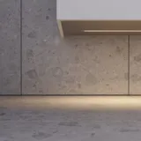 Modern bathroom in Nordic style with light wood, elegant lighting, mirror cabinet wall, and stylish decor, creating a warm and inviting atmosphere.