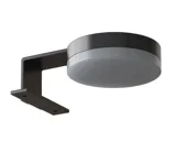 Bathroom with slanted ceiling inspiration, beige furniture with grooves, elegant countertop and square sink, beautiful mirror with shelves, blue walls, large windows, and black herringbone floor give a bright, urban look.