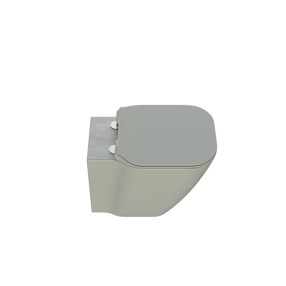 Stylish and luxurious bathroom with gentle green tones, a large elegant round mirror, and a modern, sophisticated green toilet