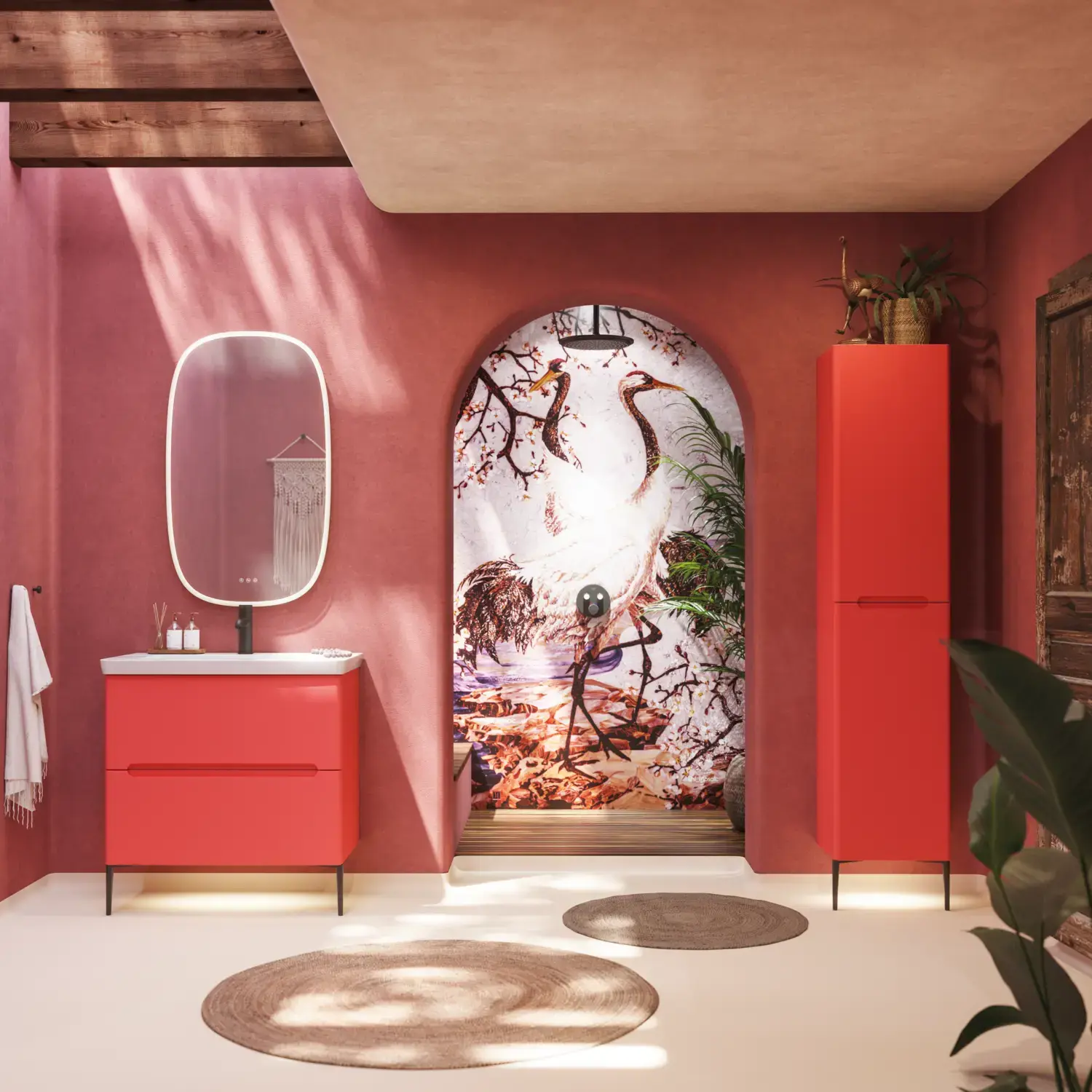 Bathroom inspiration with red walls, softly shaped red vanity and tall cabinet, elegant white sink and beautiful oval mirror with light, creating a vintage look together with the natural surroundings