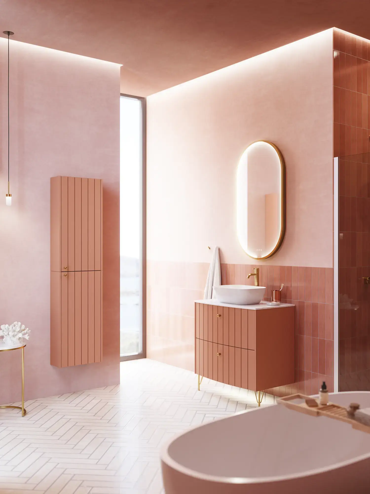 Large vintage retro bathroom inspiration with a terracotta-colored grooved vanity, elegant thin countertop with a beautiful vessel sink, stylish oval mirror with brass edge. Pink tiles and grey herringbone tiles give a romantic and feminine look