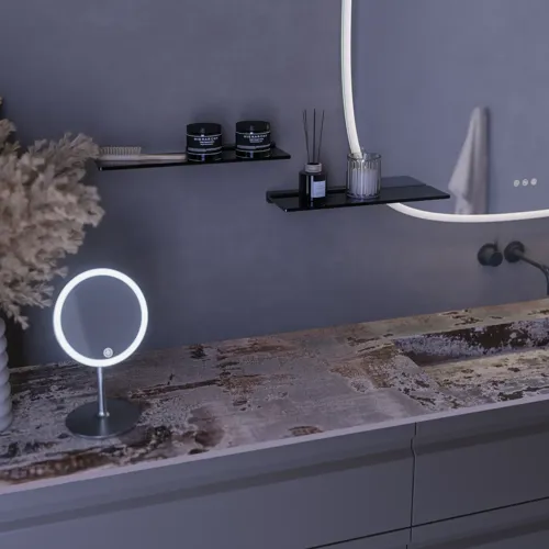 Large bathroom inspiration with grey vanity unit with integrated handle, stylish side-mounted sink, square mirror with rounded corners, concrete-look walls and raw materials for an urban look