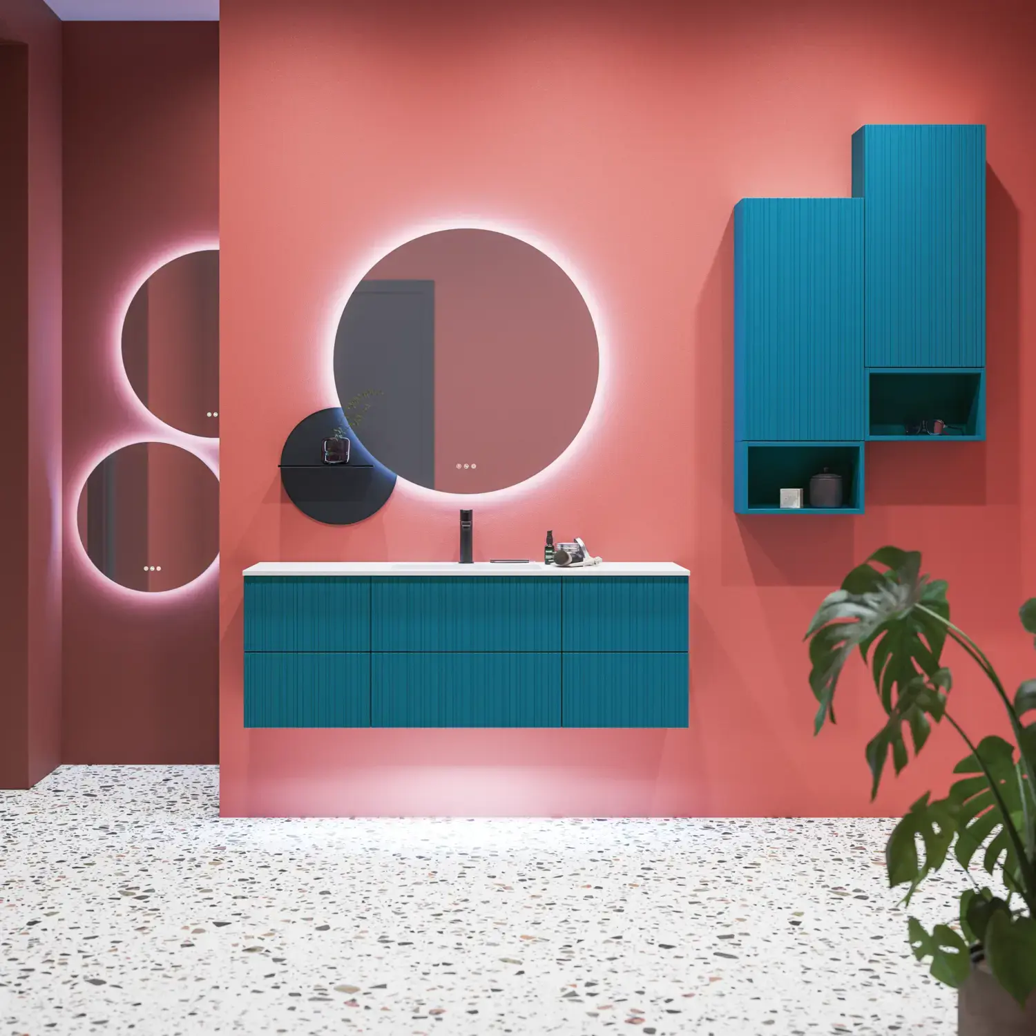 Large bathroom inspiration with blue special color grooved furniture, thin elegant sink, and beautiful round mirrors, red walls, and terrazzo floor create a strong contrast to the furniture, giving a stylish and urban look.