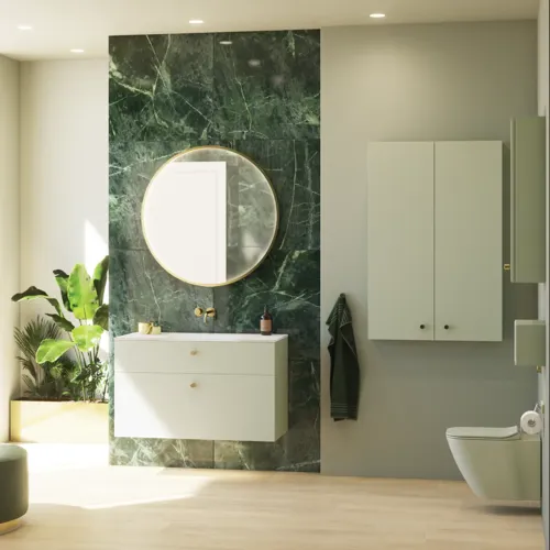 Stylish and luxurious bathroom with gentle green tones, a large elegant round mirror, and a modern, sophisticated green toilet