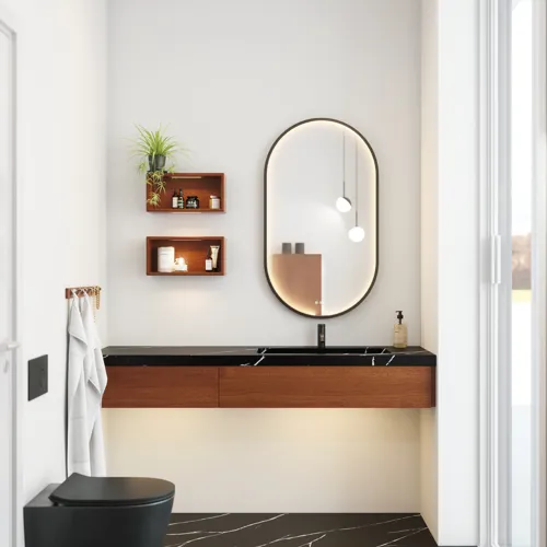 Modern and stylish bathroom inspiration with an oval mirror with a black frame and light control, colored toilet, vanity unit, base cabinets, and cabinets in reddish-brown oak, Silestone sink and matching floor
