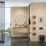 Stylish bathroom in Scandinavian and Japandi design with light wood walls, round mirror, and minimalist bathroom furniture