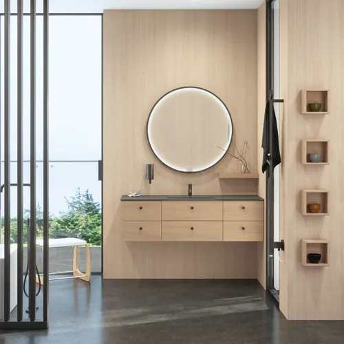 Stylish bathroom in Scandinavian and Japandi design with light wood walls, round mirror, and minimalist bathroom furniture