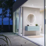 Lovely large bathroom with furniture in light, blue colors oozing with Nordic style