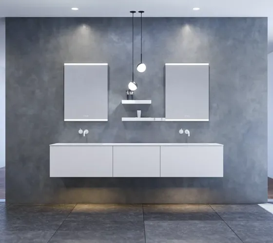 Large and modern minimalist bathroom inspiration with double sinks, square mirrors with light control, stylish pendant lights, large grey tiles, and a spacious design with plenty of natural light