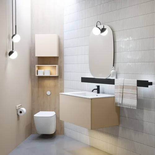 Stylish bathroom inspiration with beige vanity unit with inner drawer, upper cabinet, open shelf, oval mirror with lighting, matching pendants, shelf under the mirror, and wall-mounted toilet. Walls with light, elongated tiles