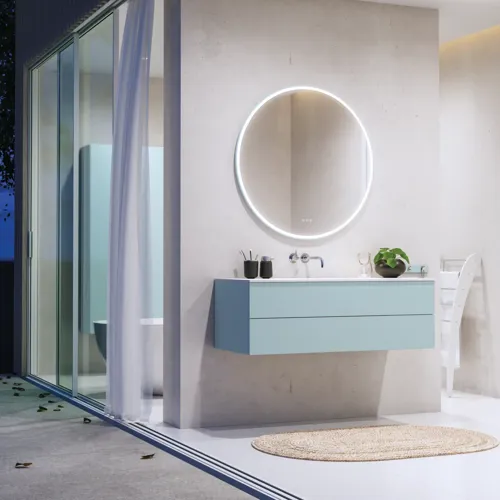 Lovely large bathroom with furniture in light, blue colors oozing with Nordic style