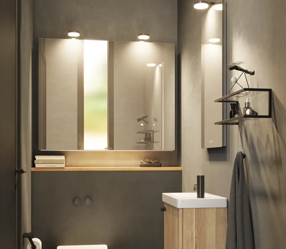 Stylish and minimalist bathroom inspiration featuring a micro basin with a small vanity unit, a square mirror with rounded corners and a lamp, and an elegant mirror cabinet.