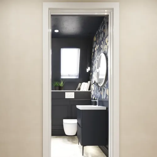 Bathroom inspiration with dark blue wall panels, romantic floral wallpaper, dark blue vanity with soft curves, and a beautiful round mirror with light, creating a vintage look