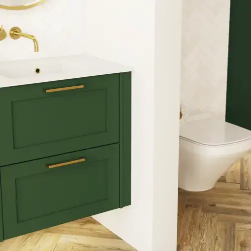 Large bathroom in green colors with vanity unit, brass framed oval mirror and beautiful framed doors