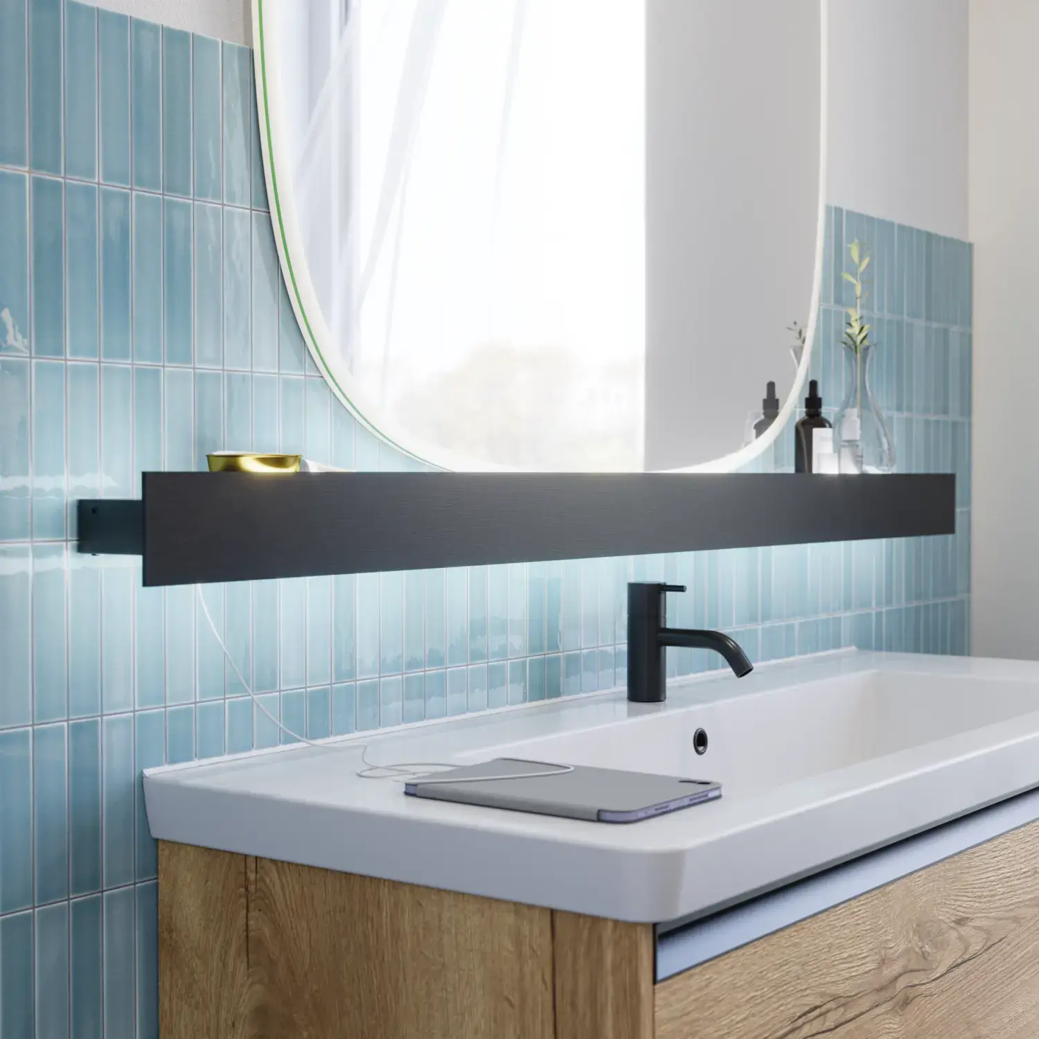 Bathroom inspiration with elongated blue tiles, natural oak bathroom furniture with black details, creating a harmonious and sophisticated look