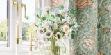 Bathroom inspiration with green special color bathroom furniture with natural oak sides, elegant grooves, stylish countertop with romantic oval countertop sink, beautiful oval mirror, combined with floral wallpaper gives a graceful, vintage retro look.