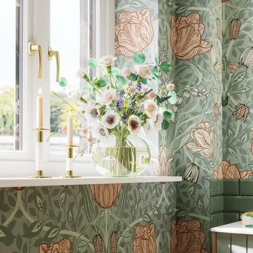 Bathroom inspiration with green special color bathroom furniture with natural oak sides, elegant grooves, stylish countertop with romantic oval countertop sink, beautiful oval mirror, combined with floral wallpaper gives a graceful, vintage retro look.