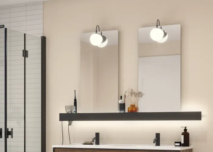 Large bathroom inspiration with brown oak furniture, black frame fronts, double sink, black shelf, rounded mirrors, black corner shower with folding doors, white tiles, and beige walls for a modern look