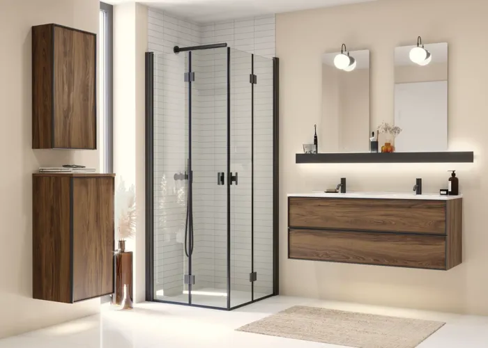 Large bathroom inspiration with brown oak furniture, black frame fronts, double sink, black shelf, rounded mirrors, black corner shower with folding doors, white tiles, and beige walls for a modern look