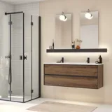 Large bathroom inspiration with brown oak furniture, black frame fronts, double sink, black shelf, rounded mirrors, black corner shower with folding doors, white tiles, and beige walls for a modern look