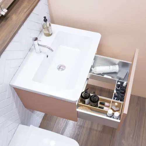 Small bathroom inspiration with a washbasin cabinet in a special color, mirror cabinet with lights, decorative mirrors with tinted glass shelf, white herringbone tiles give a sleek and classic look.