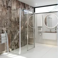 Bathroom inspiration with luxurious shower cubicle with sliding door, white bathroom furniture and a raw-look wall that gives the bathroom a raw and urban feel