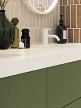 Large and luxurious bathroom with lovely oval mirrors and beautiful tiles in natural colours