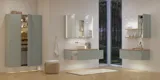 Large bathroom inspiration in Nordic style with bathroom furniture in light blue colour and wooden countertop with elegant countertop basin, herringbone wooden floor creating a bright and classic style