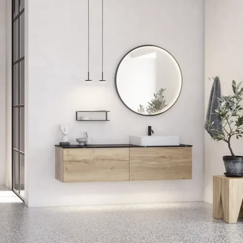 Large urban bathroom inspiration with natural oak furniture, stone countertop with square basin, round mirror with black frame, natural colors, and terracotta floor for an industrial and modern look