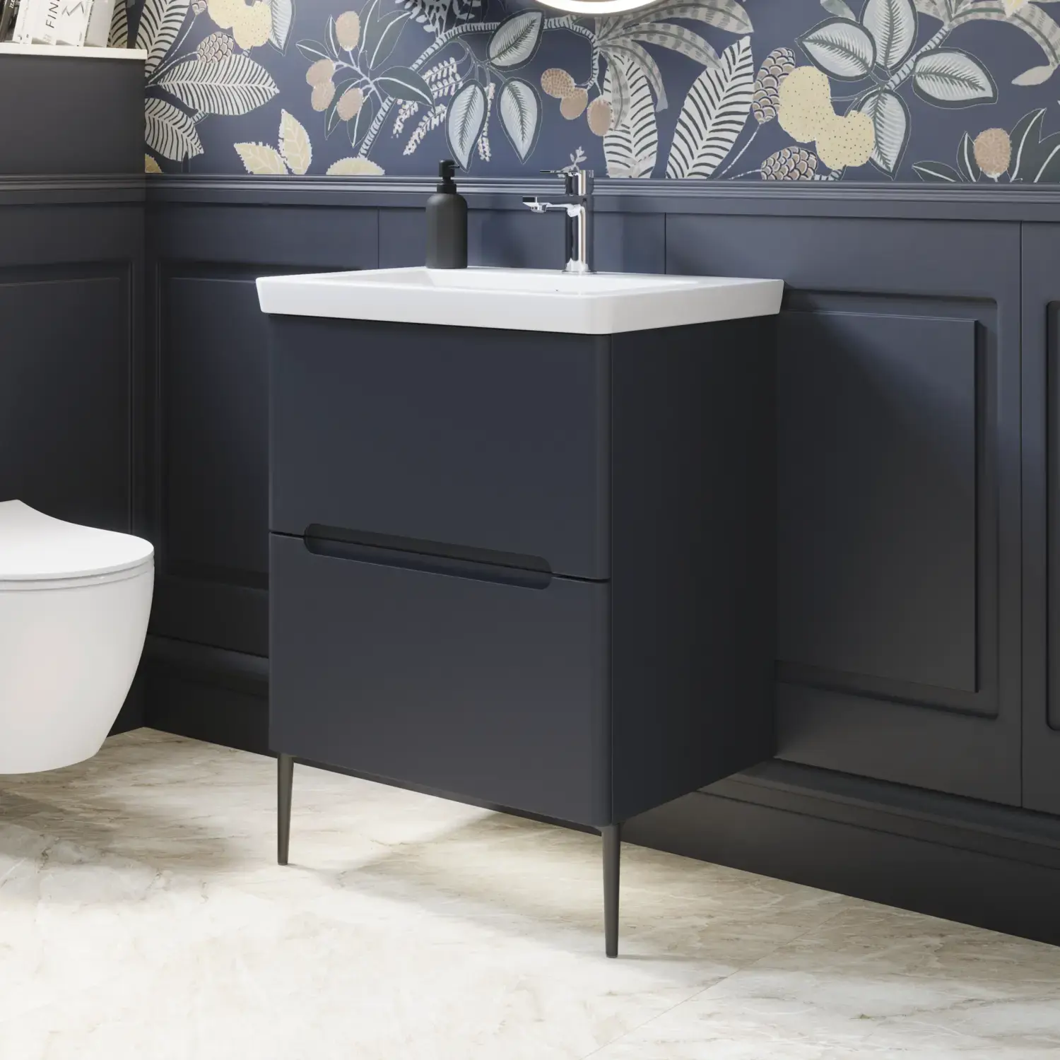 Bathroom inspiration with dark blue wall panels, romantic floral wallpaper, dark blue vanity with soft curves, and a beautiful round mirror with light, creating a vintage look