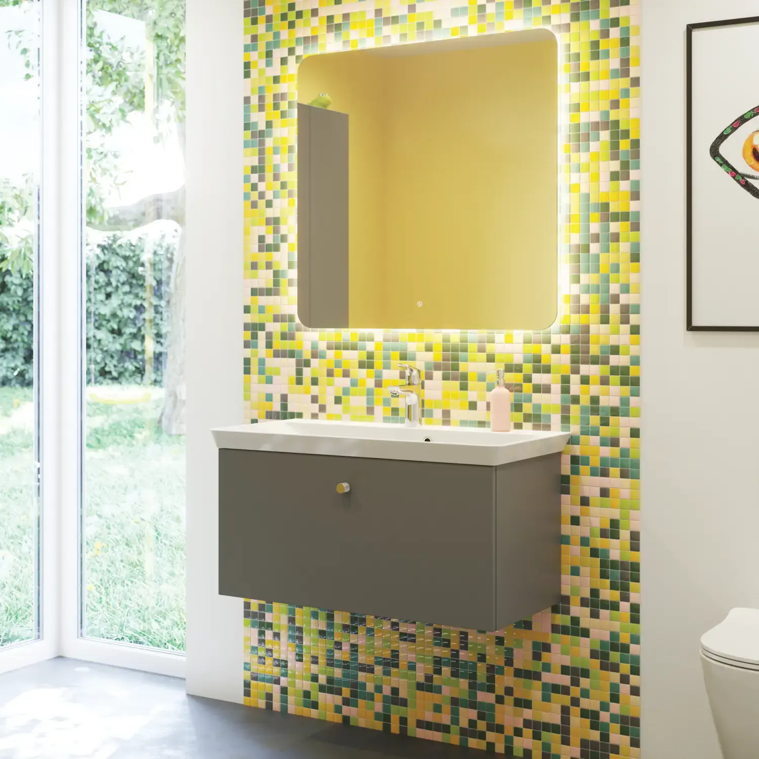Bathroom inspiration with bathroom furniture in matt grey with elegant washbasin, beautiful square mirror, grey floor and small tiles in different shades of yellow and green, which with yellow wall gives a bright and playful expression
