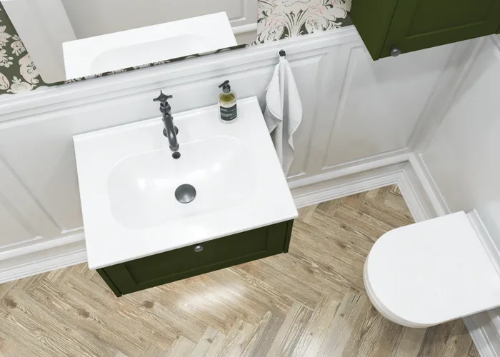 Small bathroom inspiration in a classic style with vanity unit and olive green cabinet, a beautiful square mirror, herringbone floor, and wallpaper provide a luxurious and refined look.