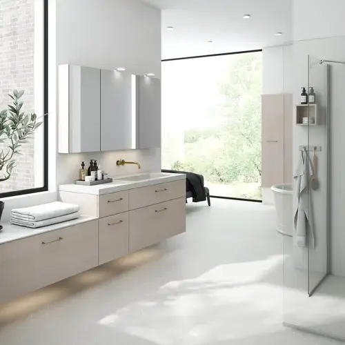 Bright and inviting bathroom with shower enclosure and stone worktop