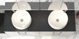 Romantic bathroom inspiration with mirror cabinet offering practical and graceful storage solutions, double countertop sinks on a stone countertop.
