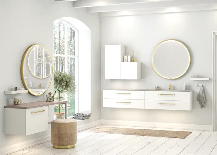 Large and romantic bathroom with brass framed round mirror
