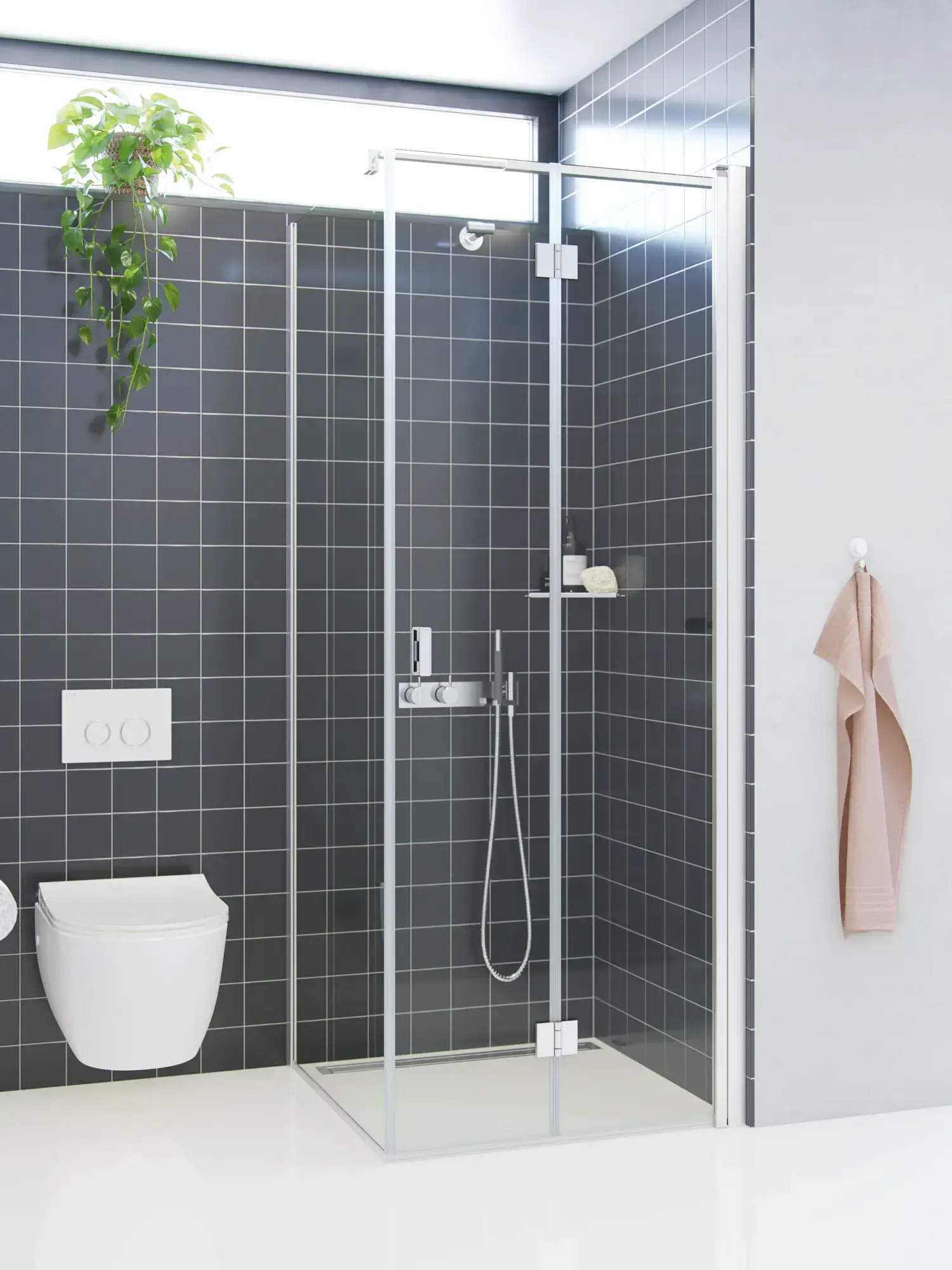 Bathroom inspiration with a shower screen with fixed wall and folding door in clear glass and satin that gives a bright and modern look.