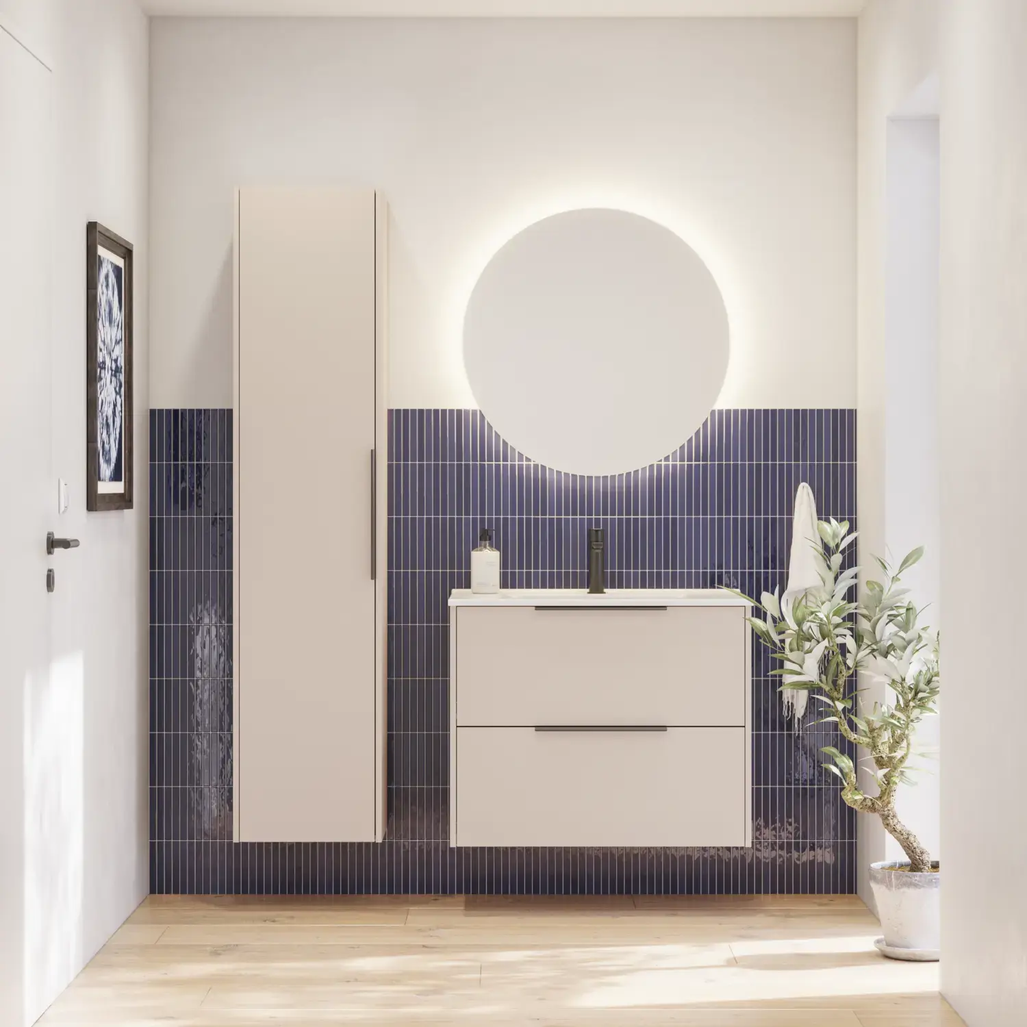 Bathroom inspiration with elongated blue tiles, elegant beige vanity unit and tall cabinet with black, minimalist and elongated handles and a round mirror with light for a beautiful and contrasting look.