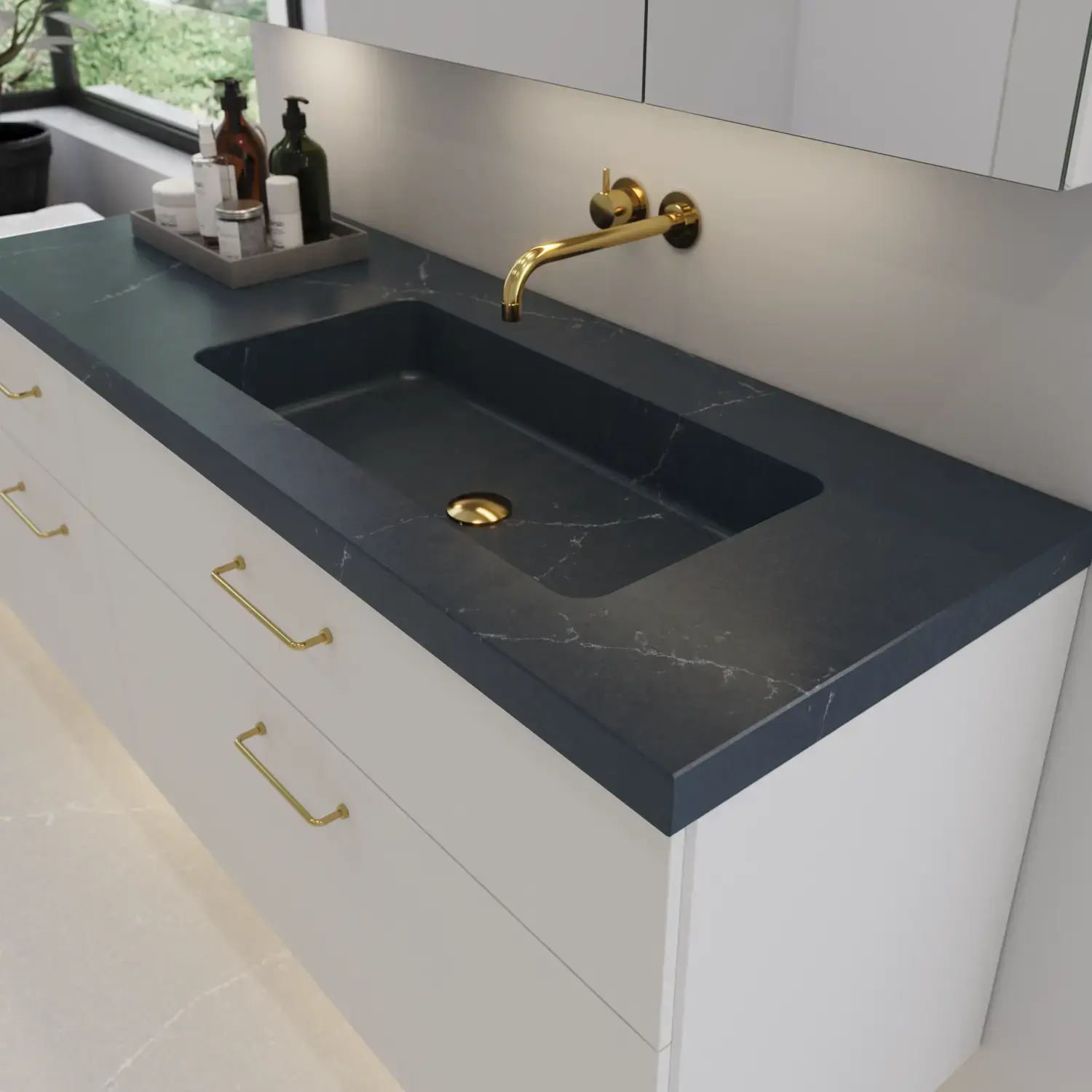 Large bathroom inspiration with elegant stone sink in Charcoal Soapstone with stylish white vanity unit with brass handles and beautiful mirror cabinet with stone floor for an exclusive and modern look.