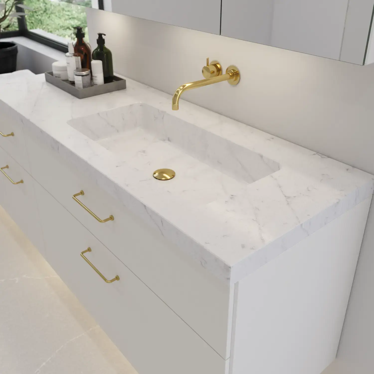 Large bathroom inspiration with elegant stone sink in Eternal Statuario with stylish white vanity unit with brass handles and beautiful mirror cabinet with stone floor for an exclusive and modern look.